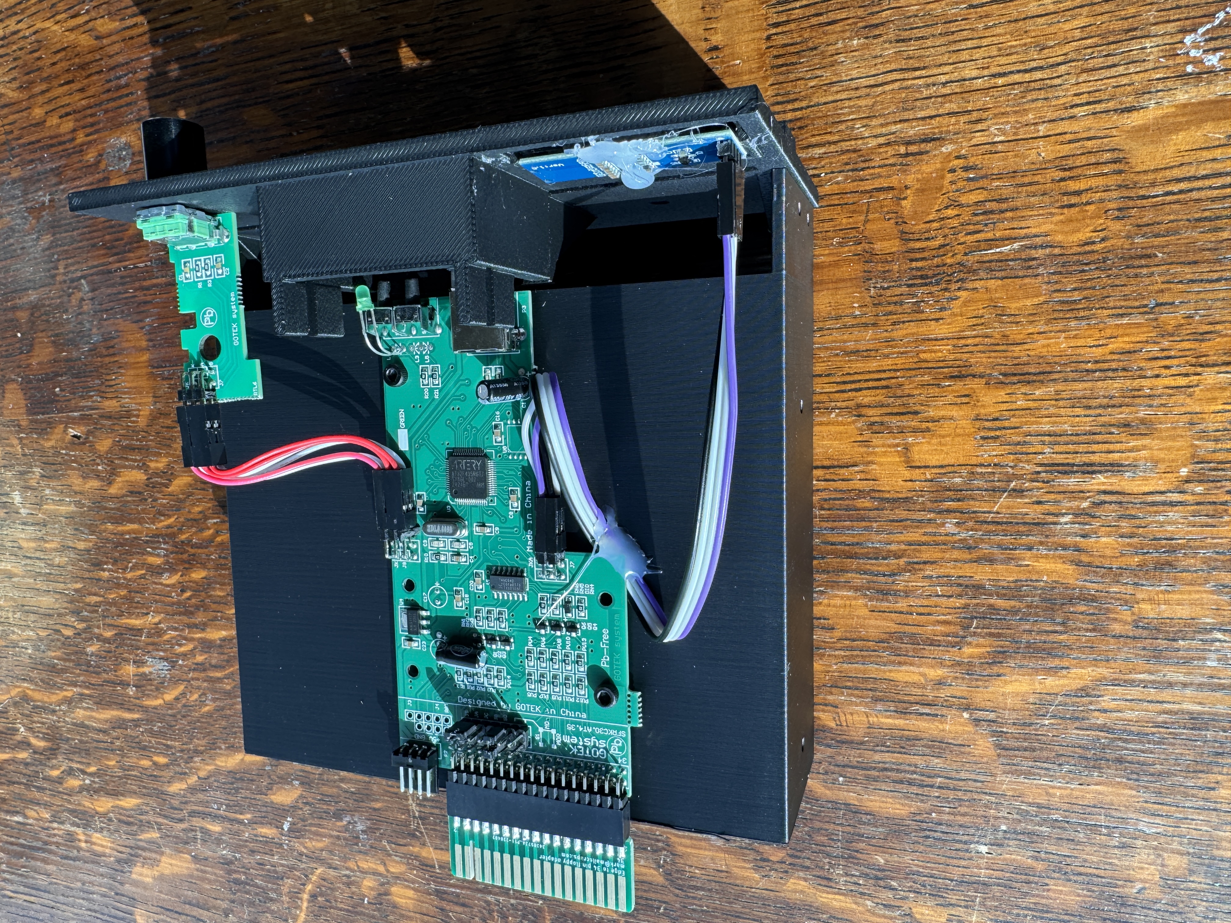 Rear view of custom 3D printed bezel with electronics visible