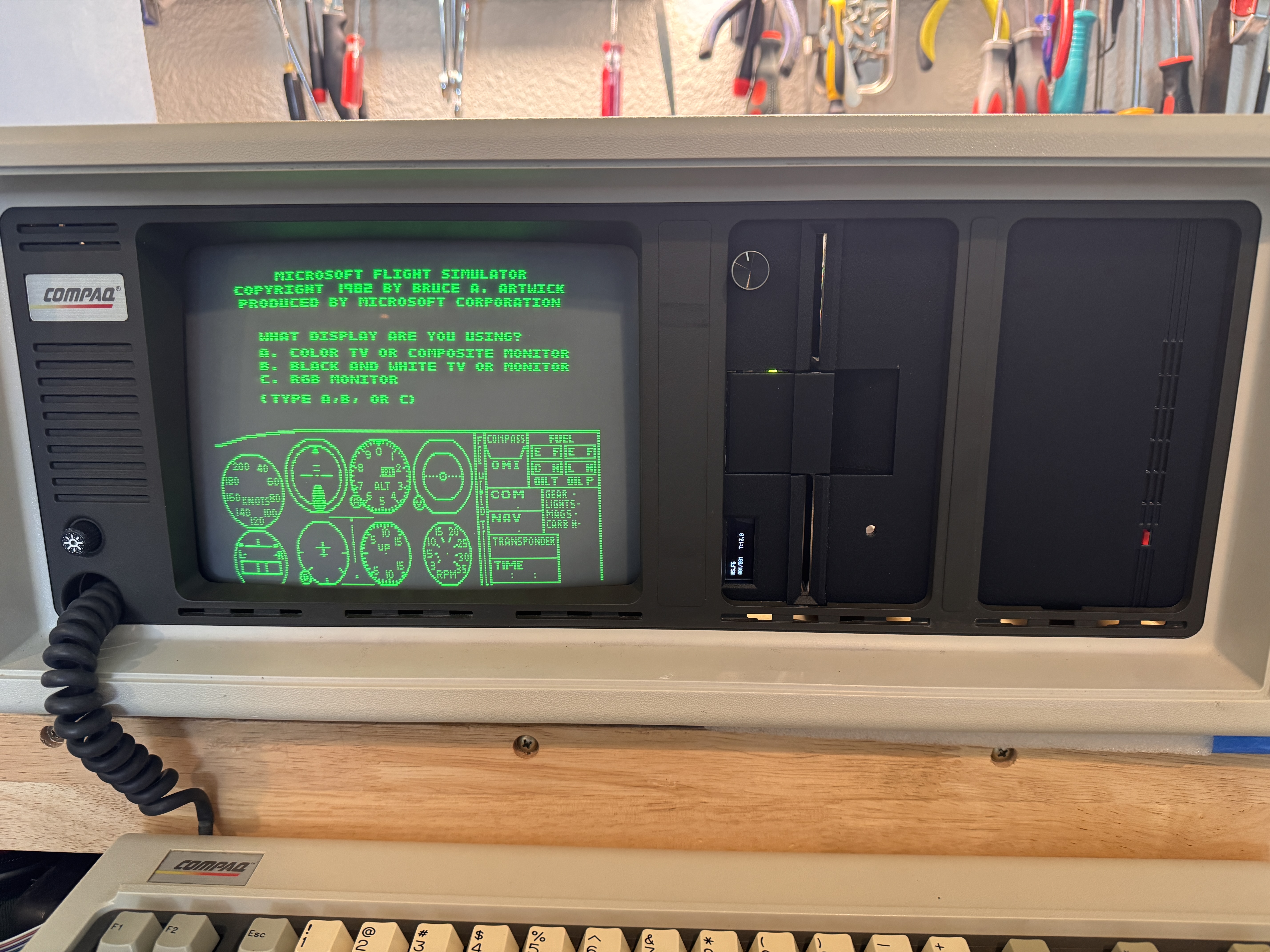 Restored Compaq Portable showing the completed custom drive bezels and active display
