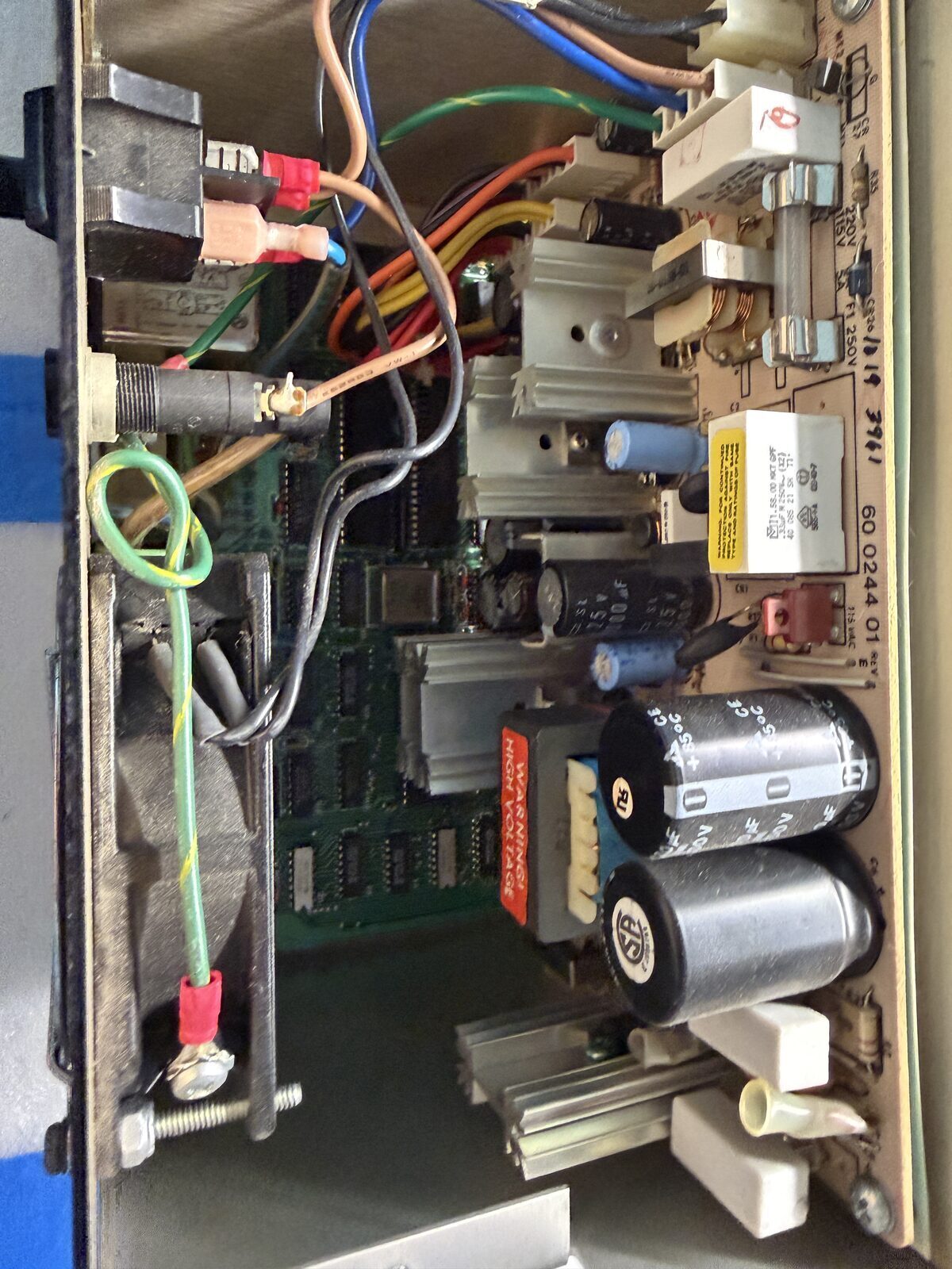 The powersupply is at the rear, under tha back cover