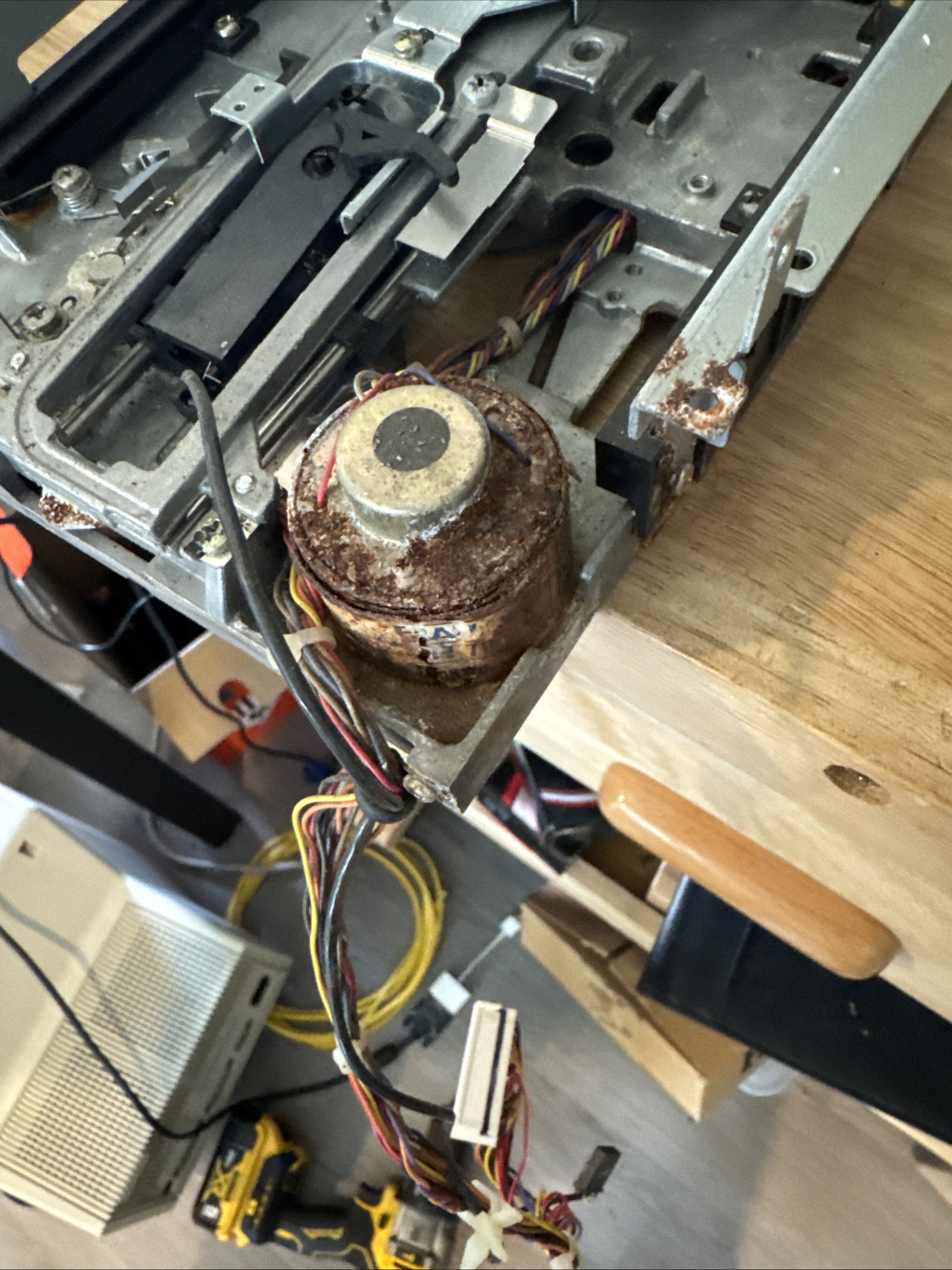 Close‑up of a rusted SX‑64 floppy drive motor